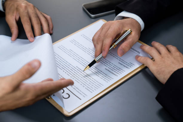 istock Closeup hand signing contract document with pen. Fervent. 1480349579