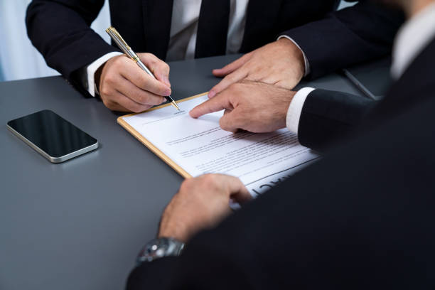 istock Closeup hand signing contract document with pen. Fervent. 1480349635