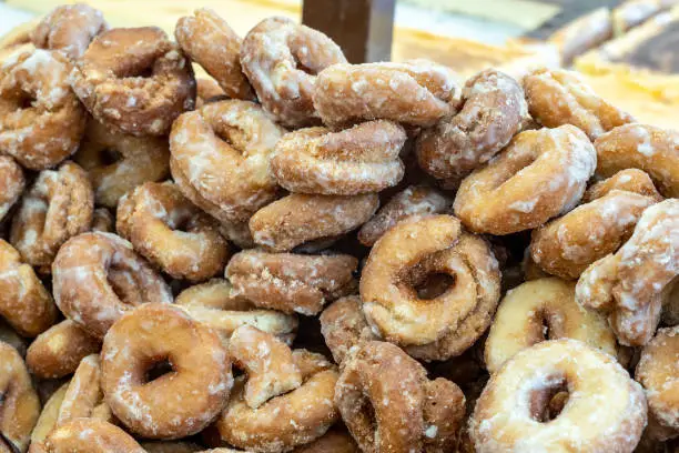 Photo of A close-up of traditional Spanish homemade fried donuts covered in sugar, fresh from the market, a sweet treat