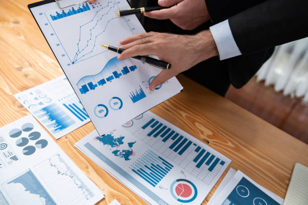 istock Closeup busy analyst team discussing financial data on laptop. Fervent 1480353954