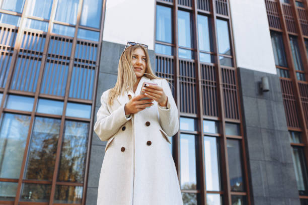 istock Businesswoman using smart phone in city 1480354022