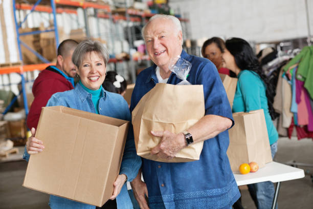 istock Adults with donations at a charity donation center 148035483