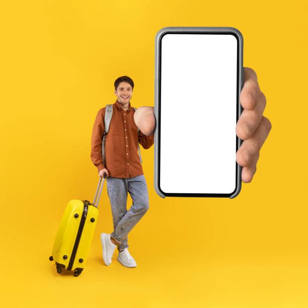 istock Tourist Man Showing Phone With Huge Blank Screen, Yellow Background 1480361161