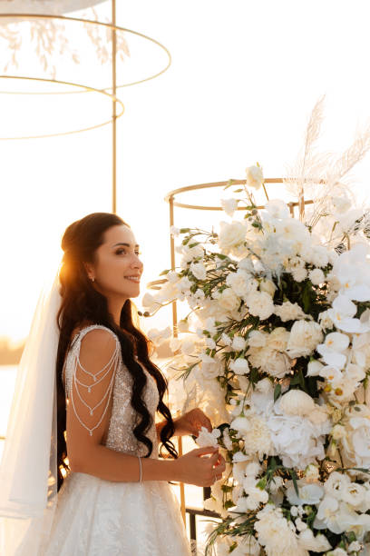 istock bride against the background of a yellow sunset 1480362120