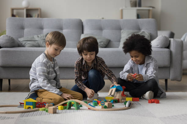 istock Three diverse little preschool boys playing with toys 1480370458