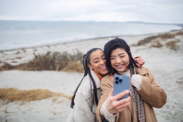 istock Two young women taking a selfie on a beach 1480373614