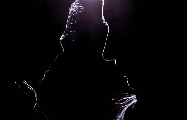 Side view of mother and daughter looking at each other