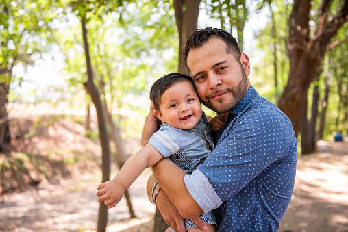 Man with his child in a nature park