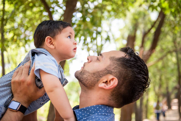 istock Man with his child in a nature park 1480373874