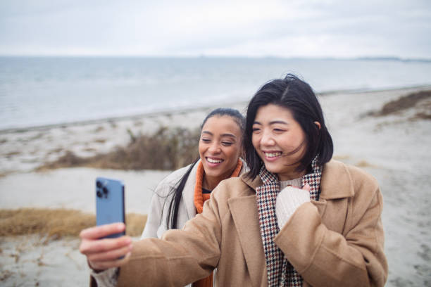 istock Two young women taking a selfie on a beach 1480374037