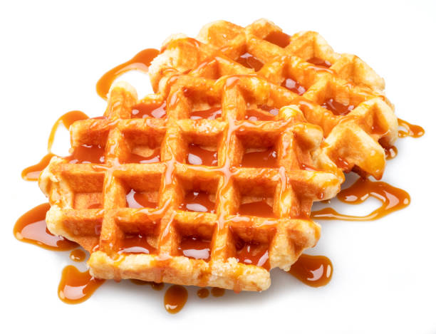 istock Belgian waffle with caramel topping isolated on white background. 1480376441