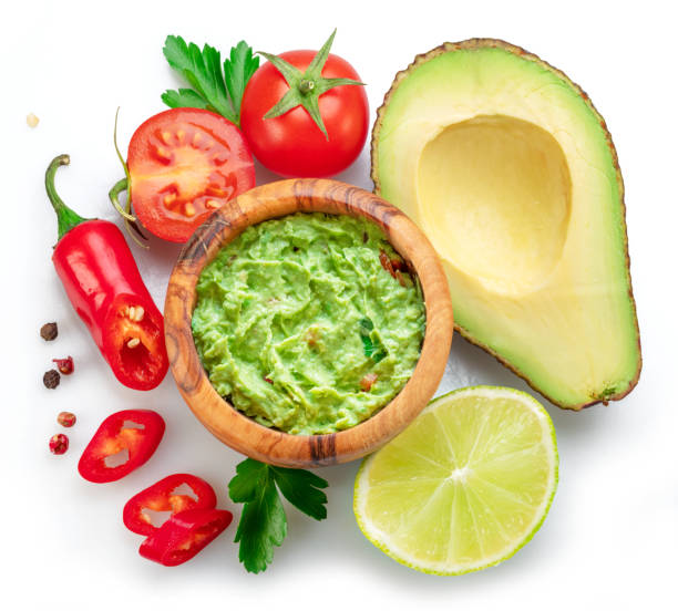 istock Guacamole and guacamole ingredients isolated on white background. Flat lay. 1480377445