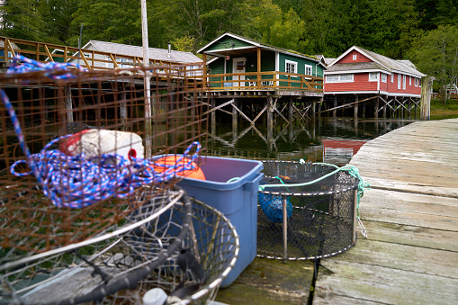 Crab pots on the Telegraph Cove marina dock. Historic boardwalk in the background.