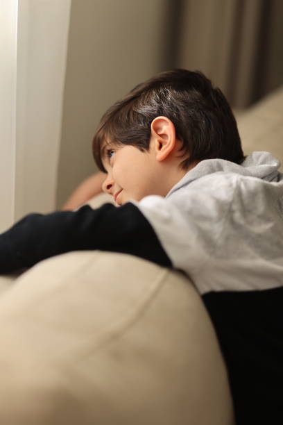 istock Young Boy Relaxing On Sofa At Home 1480379558