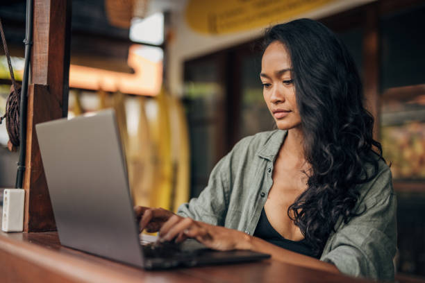 istock Beautiful woman using laptop 1480381094