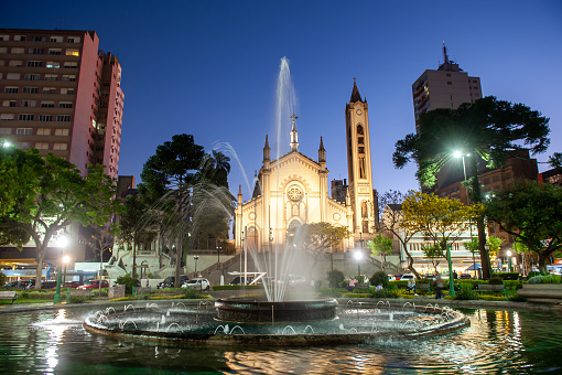 Beautiful night view of fountain, Dante Alighieri Square and cathedral in Caxias do Sul city center; RS, Brazil