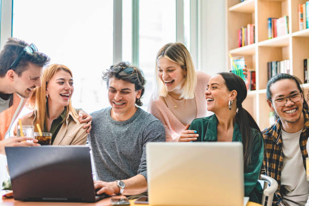istock Young multiracial students working in school college library- Happy friends studying at university classroom using laptop and drinking soft cocktails- Education research concept with girls and guys 1480385082