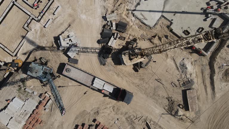 A crane lifts a heavy load at a construction site