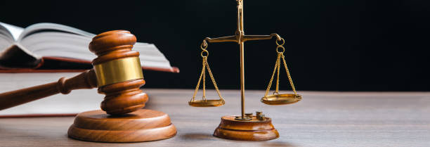 istock scales with judge gavel and law book 1480397244