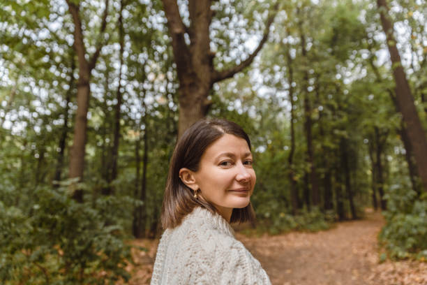 istock Young woman enjoying natural park 1480398809