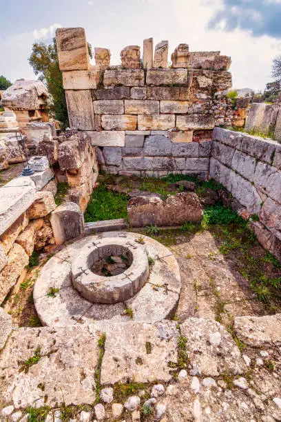 Photo of The archaeological site of Eleusis. Well of the fair dances where goddess Demeter rested, when she first came to Eleusis.