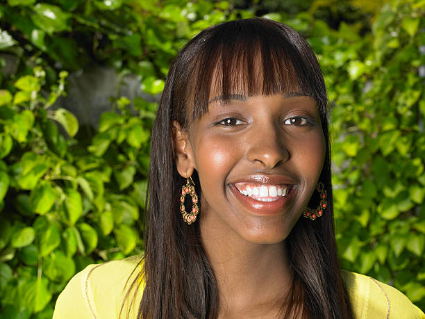 istock Young woman smiling, portrait, close-up 148040563