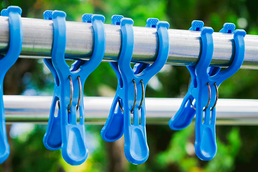 Laundry outdoors and blue clothespins