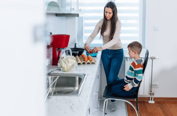 istock Mother and Son Making Cookies in the Kitchen 1480411959