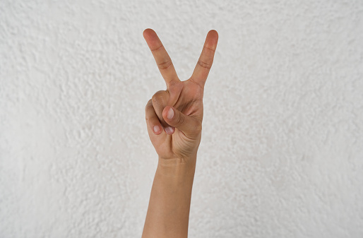 Peace and Love gesture on white background