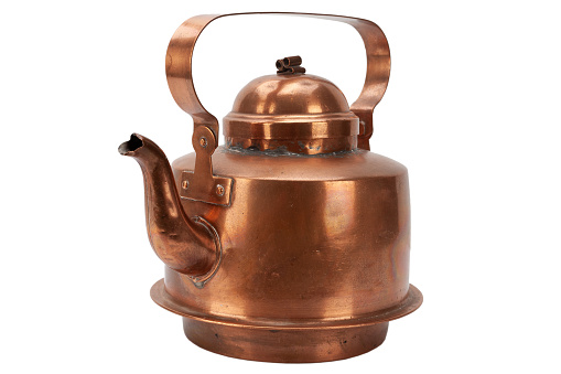 Vintage antique copper teapot isolated on white background