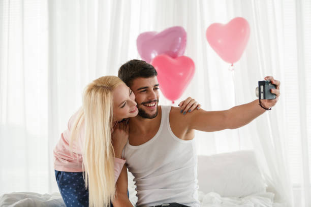 istock Happy couple taking a selfie together and smiling 1480425761