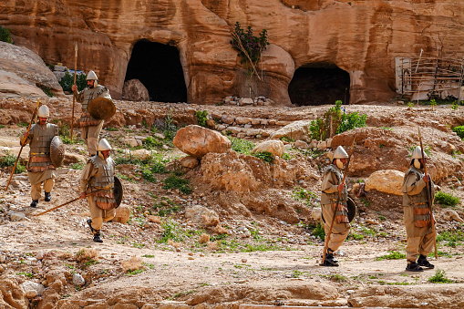 Petra, Jordan March 23, 2023 People reeancting Roman soldiers on the Siq trail.