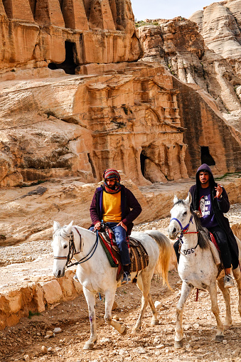 Petra, Jordan March 23, 2023 Bedouin tour guides on horseback in the park.