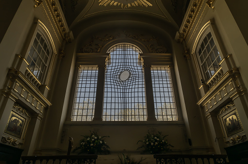 LONDON, UK - APR 19, 2019 : Leaded glass window at St. Martin in the fields church at the north-east corner of Trafalgar Square.