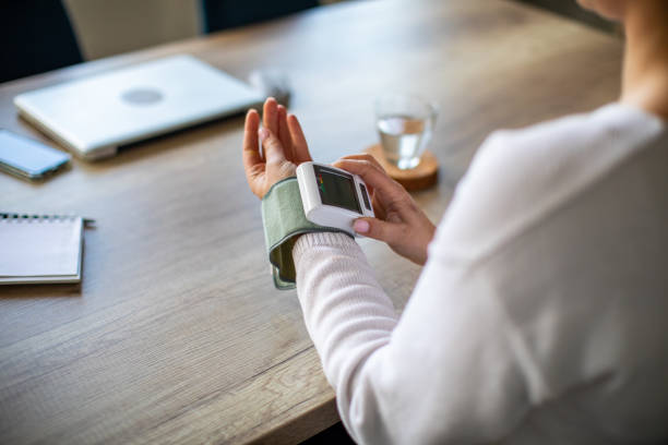 istock Woman measuring blood pressure 1480437789