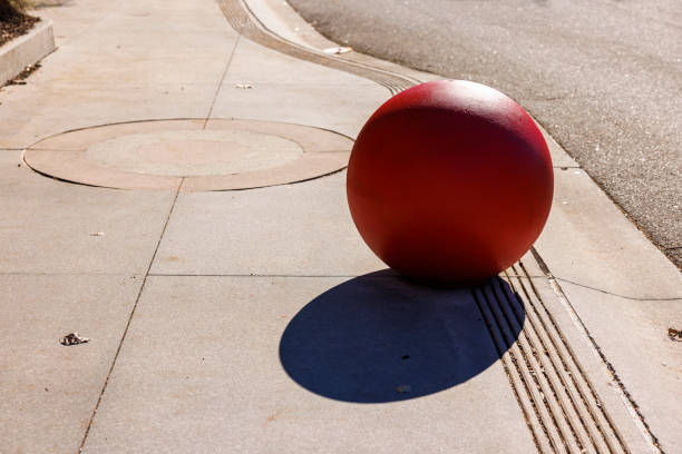 Concrete spheres in the street, using for sight improvement and as a parking barrier.