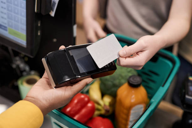 istock Unrecognizable young woman using credit card mockup in supermarket 1480439911