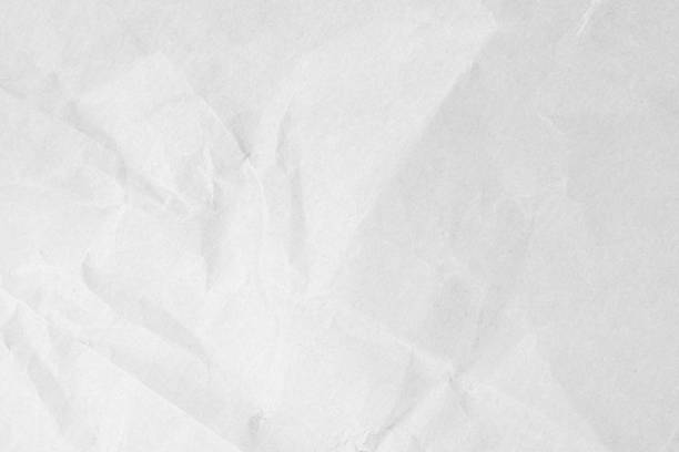 istock White recycled craft paper texture as background. Grey paper texture material, Old vintage page light wrinkle tone vignette of old newspaper and journal blank. Paperwork pattern letter for text. 1480450393