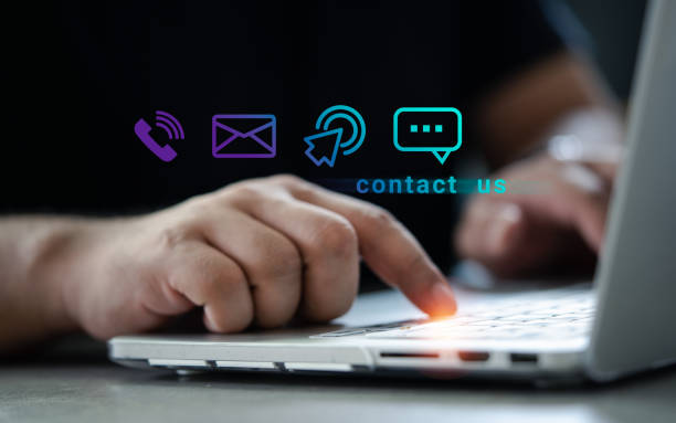 Man using a notebook with contact us or customer support hotline people connect (email, cell, message, chat). Man using a notebook with contact us or customer support hotline people connect (email, cell, message, chat). Customer support hotline contact email marketing automation stock pictures, royalty-free photos & images