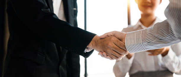 istock Businessmen making handshake with his partner - business etiquette, congratulation, merger and acquisition concept 1480453294