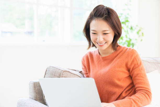 istock young asian woman using laptop 1480453607