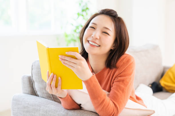 istock attractive asian woman who reads a book, 1480453717