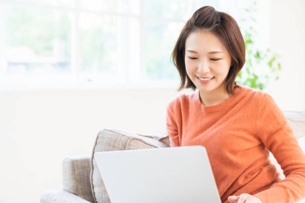 istock young asian woman using laptop 1480454002