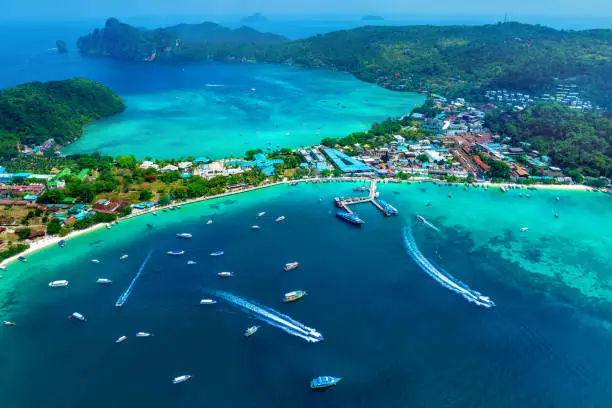 Aerial view of Phi phi island with speedboat sailing on the sea, Thailand.