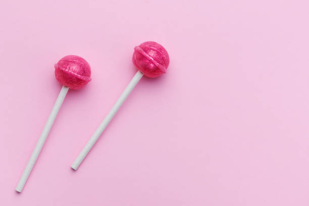 istock Sweet lollipops on pink background 1480471929