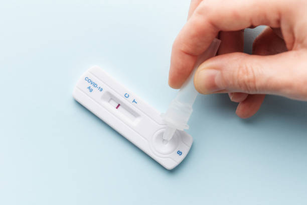istock Hand holding a negative result for COVID-19 1480472129