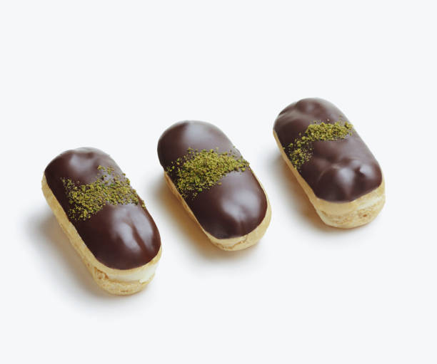 Eclairs sweet on the white background