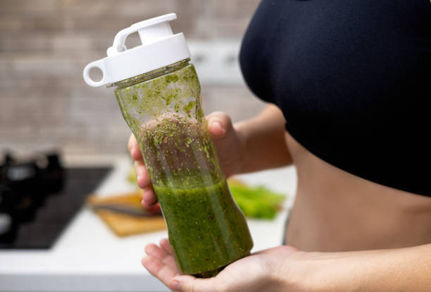 istock woman doing healthy smoothie at kitchen 1480481241