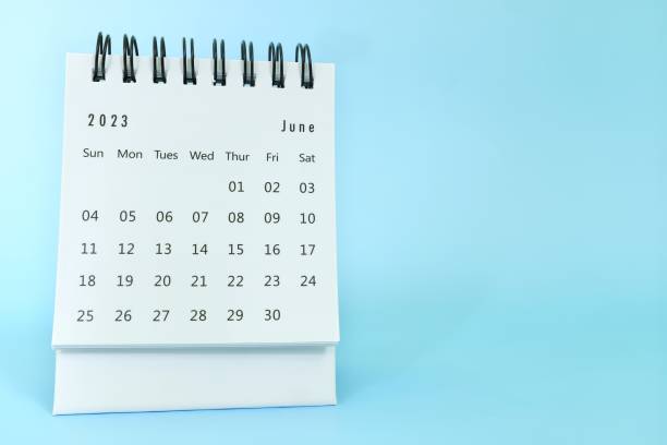 istock Selective focus of June 2023 desk calendar on blue background with copy space. 1480487718