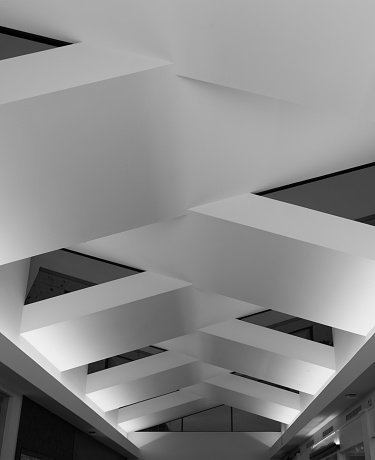 Modern and conteporary arcitectural fiction. Abstract architecture fragment. Abstract modern architecture. Interior design with minimal geometric. Angular and polygonal structure of ceiling.